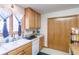 Bright kitchen with ample cabinetry and a double sink at 2617 E Egbert St, Brighton, CO 80601