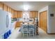 Eat-in kitchen with ample counter space and wood cabinetry at 2617 E Egbert St, Brighton, CO 80601
