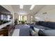 Spacious living room with vaulted ceilings, comfy sectional sofa, and large TV at 2617 E Egbert St, Brighton, CO 80601