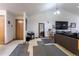 Open concept living room with a view into the kitchen area at 2617 E Egbert St, Brighton, CO 80601