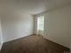 Simple bedroom with neutral walls and carpet at 11479 E 1St Ave, Aurora, CO 80010