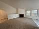 Living room with fireplace and access to other rooms at 11479 E 1St Ave, Aurora, CO 80010