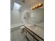 Clean bathroom with a shower/tub combo and updated vanity at 11479 E 1St Ave, Aurora, CO 80010