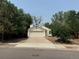 Single-story house with attached garage and driveway at 11479 E 1St Ave, Aurora, CO 80010