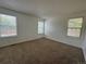 Bright bedroom with neutral carpeting and deck views at 11479 E 1St Ave, Aurora, CO 80010