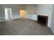 Living room with fireplace and a half-wall separating it from the kitchen at 11479 E 1St Ave, Aurora, CO 80010