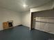 Unfinished basement with painted floor and storage at 11479 E 1St Ave, Aurora, CO 80010
