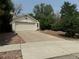 Single-story house with attached garage and driveway at 11479 E 1St Ave, Aurora, CO 80010