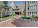 Inviting brick building exterior with landscaped walkway at 4605 S Yosemite St # 301, Denver, CO 80237