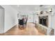 Dining area with hardwood floors and granite fireplace at 1219 Tucson St, Aurora, CO 80011