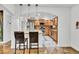 Kitchen with wooden cabinets, stainless steel appliances, and a breakfast bar at 1219 Tucson St, Aurora, CO 80011