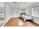 Cozy bedroom with hardwood floors and window blinds at 1219 Tucson St, Aurora, CO 80011