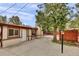 Spacious backyard with patio, gazebo, and mature trees at 1219 Tucson St, Aurora, CO 80011