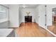 Simple bedroom with hardwood floors and dresser at 1219 Tucson St, Aurora, CO 80011