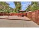 Spacious backyard with a pergola, patio, and a water feature at 1219 Tucson St, Aurora, CO 80011