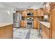 Modern kitchen with stainless steel appliances and granite countertops at 1219 Tucson St, Aurora, CO 80011