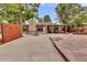 Large backyard with patio, covered seating area and a fire pit at 1219 Tucson St, Aurora, CO 80011