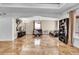 Living room featuring two leather sofas, a coffee table, and tile floors at 1219 Tucson St, Aurora, CO 80011