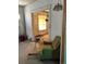 Living room with a vintage armchair and a view into another room at 1053 N Colorado Blvd, Denver, CO 80206