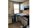 Dated kitchen with worn countertops and cabinets requiring updates at 1053 N Colorado Blvd, Denver, CO 80206