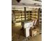 Unfinished basement with shelving and various boxes at 1053 N Colorado Blvd, Denver, CO 80206