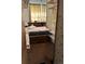 Small bedroom with a double bed and built-in shelves at 1053 N Colorado Blvd, Denver, CO 80206