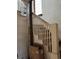 View of an interior staircase with wooden banisters and carpeted steps at 1053 N Colorado Blvd, Denver, CO 80206