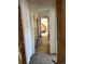 Long hallway with damaged walls and flooring needing work at 1053 N Colorado Blvd, Denver, CO 80206