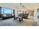 Spacious living room with large windows and comfortable seating at 738 S Main St, Byers, CO 80103