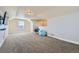 Bright bonus room featuring wall-mounted TV and seating at 738 S Main St, Byers, CO 80103