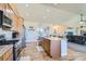 Well-equipped kitchen with stainless steel appliances and island at 738 S Main St, Byers, CO 80103