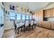 Bright dining room with hardwood floors and a large table at 738 S Main St, Byers, CO 80103