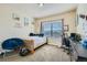Bedroom with window, desk, and twin bed at 738 S Main St, Byers, CO 80103