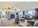 Spacious living room with fireplace and large windows at 738 S Main St, Byers, CO 80103