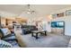 Open living room featuring a cozy seating area and kitchen views at 738 S Main St, Byers, CO 80103