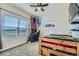 Bedroom with large window, American flag, and a bed at 738 S Main St, Byers, CO 80103