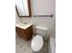 Clean bathroom with vanity, toilet, and updated fixtures at 12831 E Mexico Ave, Aurora, CO 80012