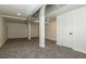 Unfinished basement with neutral carpeting and ample space at 4542 Sheridan Blvd, Denver, CO 80212