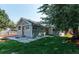Updated bungalow with a spacious backyard and a tree at 4542 Sheridan Blvd, Denver, CO 80212