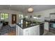 Modern kitchen with island, stainless steel appliances, and granite countertops at 4542 Sheridan Blvd, Denver, CO 80212