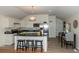 Modern kitchen with an island, stainless steel appliances, and hardwood floors at 4542 Sheridan Blvd, Denver, CO 80212