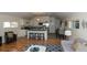 Open concept kitchen and living room with hardwood floors and modern finishes at 4542 Sheridan Blvd, Denver, CO 80212