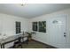 Sunlit office with desk, chair, and exterior access at 4542 Sheridan Blvd, Denver, CO 80212
