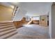 Finished basement with a carpeted floor and built-in shelving at 8160 W 81St Pl, Arvada, CO 80005