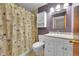 Clean bathroom, featuring a shower/tub combo and vanity at 8160 W 81St Pl, Arvada, CO 80005