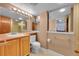 Clean bathroom with a toilet, sink, and shower at 8160 W 81St Pl, Arvada, CO 80005