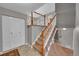 Inviting entryway with tiled flooring, staircase, and coat closet at 8160 W 81St Pl, Arvada, CO 80005