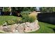 Landscaped rock wall with various plants at 8160 W 81St Pl, Arvada, CO 80005