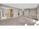Spacious living room with neutral carpeting and large windows at 8160 W 81St Pl, Arvada, CO 80005