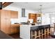 Modern kitchen with light wood cabinets, white countertops, and an island at 3328 Osage St, Denver, CO 80211